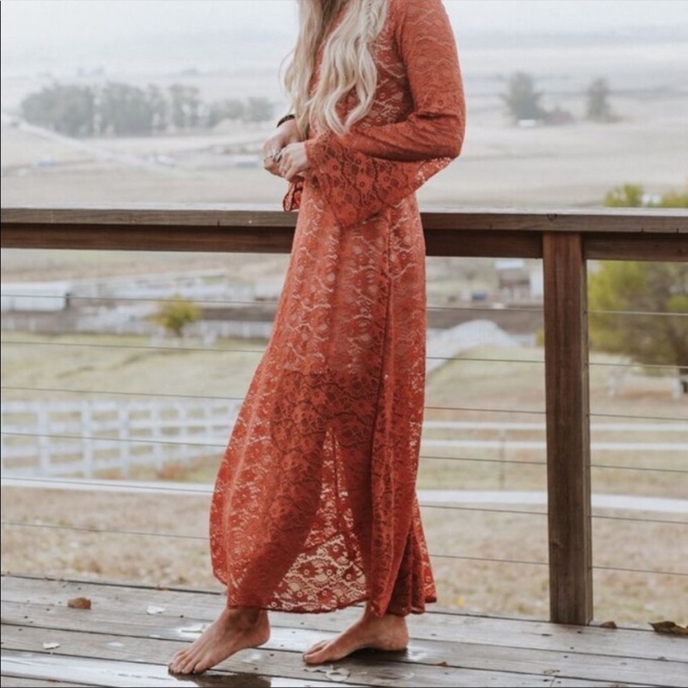 Burnt orange lace maxi dress with nude underlay and keyhole back closure.